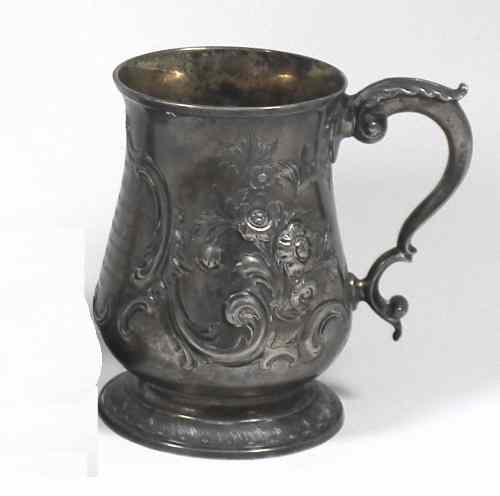 Appraisal: A George III silver baluster shaped tankard with leaf capped