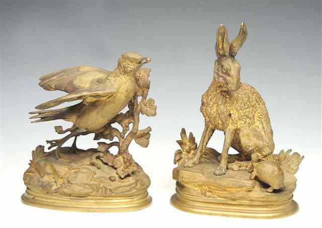 Appraisal: A GILT BRONZE GROUP of a Thrush eating berries off