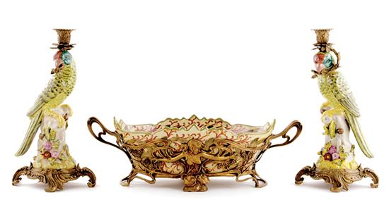 Appraisal: Ormolu-mounted parrot-form candlesticks and centerbowl vibrantly glazed parrots mounted as