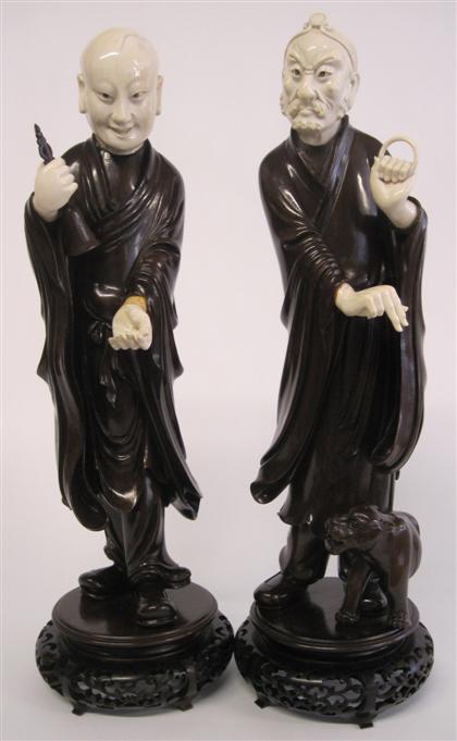 Appraisal: Two Chinese elephant ivory and hardwood luohan th th century