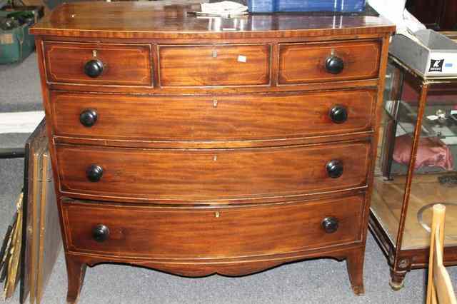 Appraisal: A TH CENTURY MAHOGANY BOW FRONT CHEST of three long