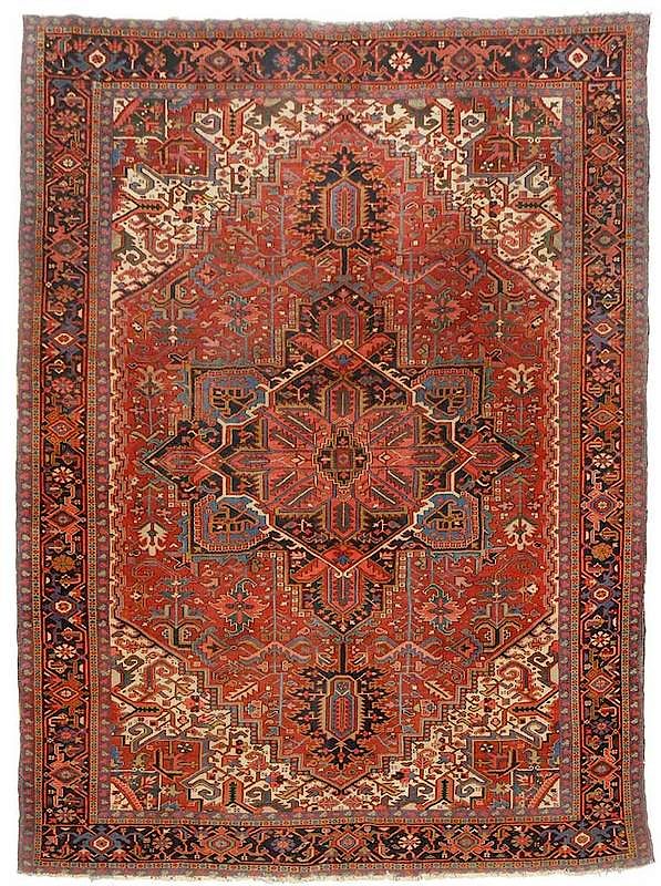 Appraisal: Heriz Carpet th century central blue medallion red field geometric