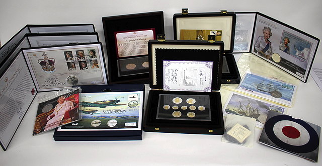 Appraisal: THREE GROUPS OF CASED BRITISH COINAGE together with further various