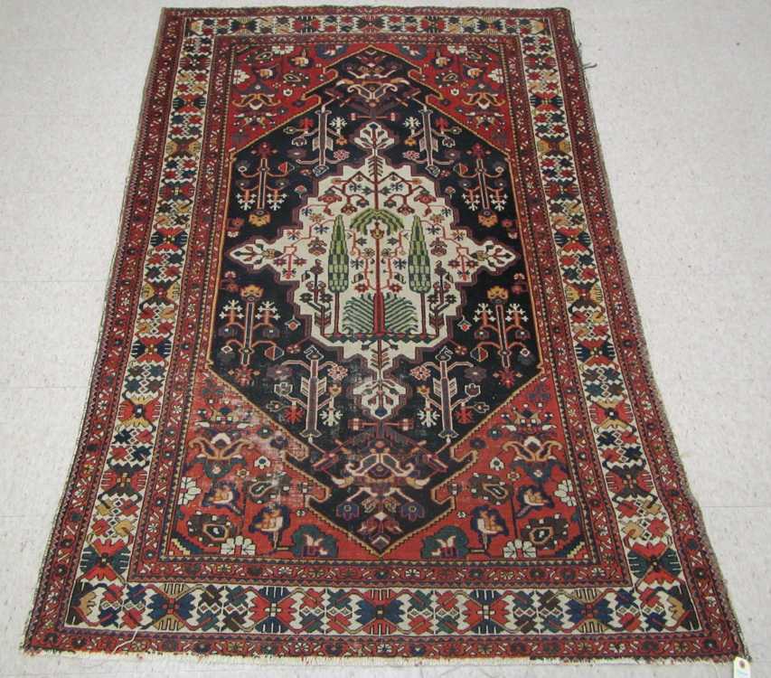 Appraisal: SEMI-ANTIQUE PERSIAN AREA RUG Caucasian influence central medallion and stylized