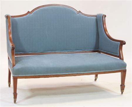 Appraisal: A Victorian mahogany frame settee the arched back over downswept