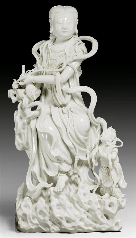 Appraisal: A FINE BLANC-DE-CHINE FIGURE OF GUANYIN WITH A BOY China