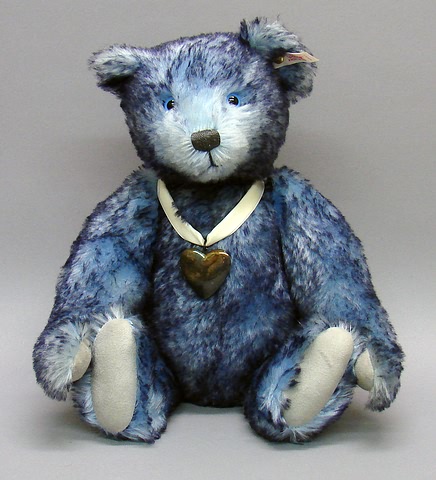 Appraisal: Tagged navy tipped blue mohair bear with sterling heart locket