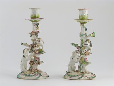 Appraisal: Two Derby candlesticks modelled as tree trunks a cat winding