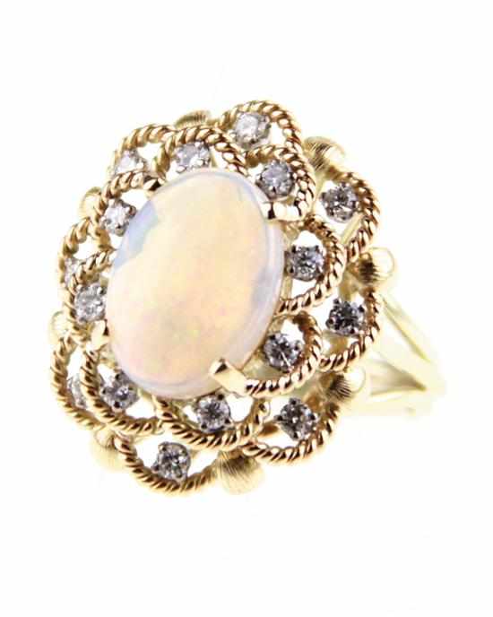 Appraisal: Opal and diamond ring x mm oval opal in K