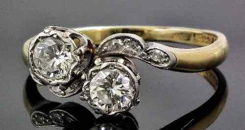 Appraisal: An ct gold and platinum mounted diamond set crossover ring