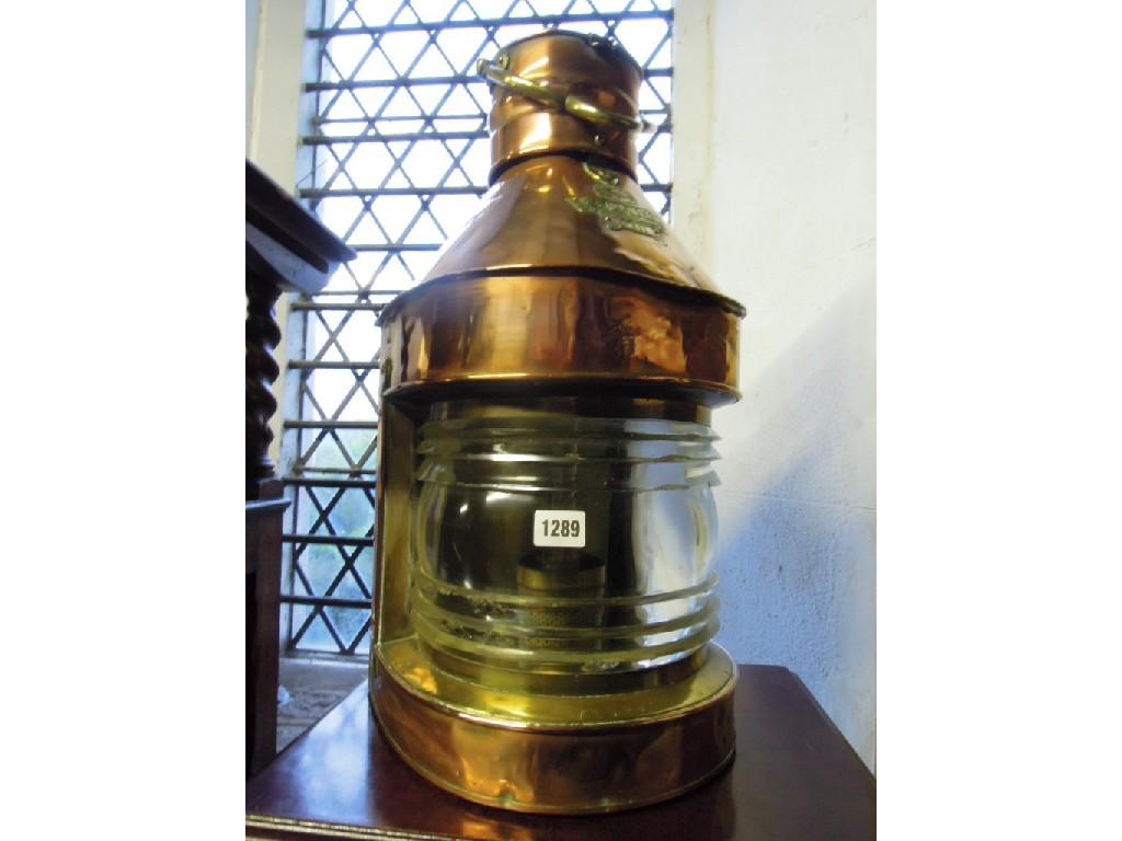 Appraisal: A polished copper ships mast head light lantern with brass