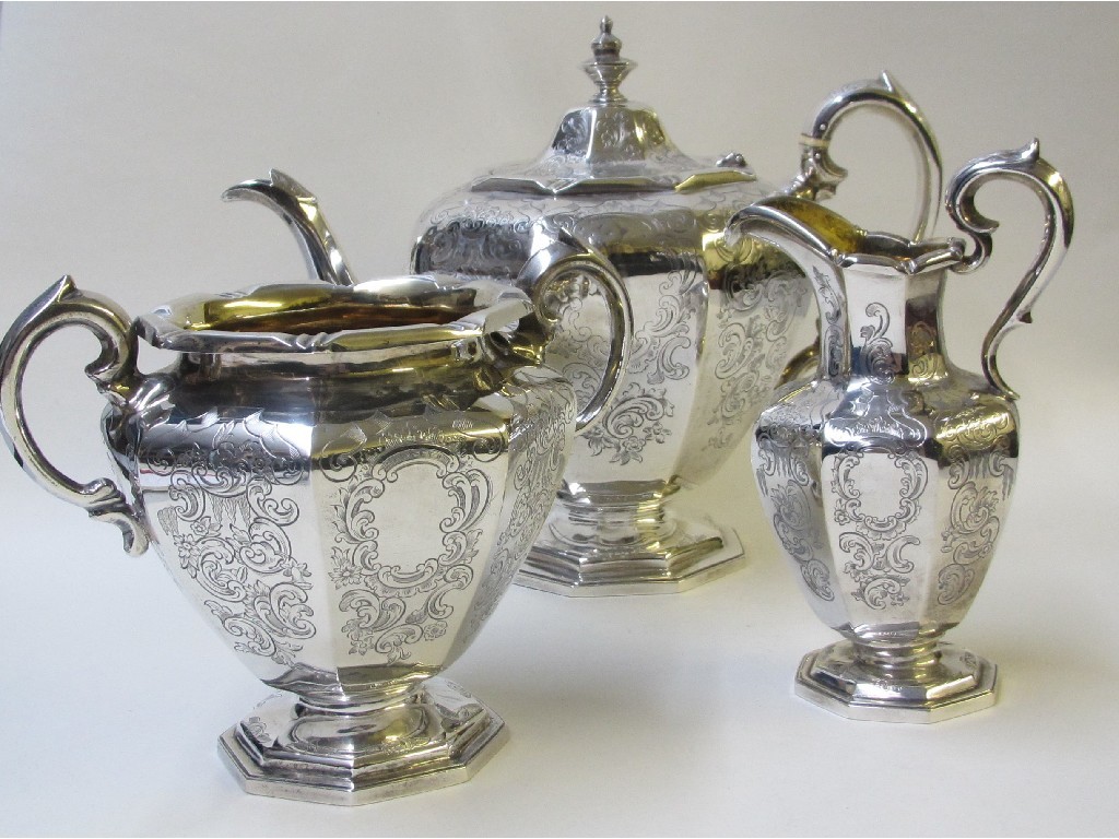 Appraisal: A Victorian silver three piece tea service comprising teapot sugar