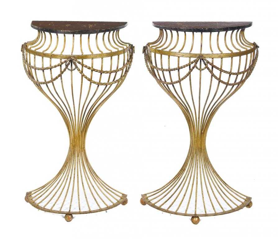 Appraisal: A PAIR OF PAINTED METAL CONSOLE TABLES the semi-circular painted