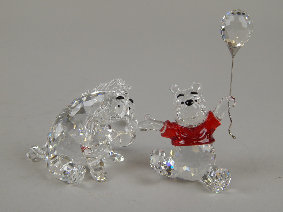 Appraisal: A Swarovski crystal figure of Winnie the Pooh holding a