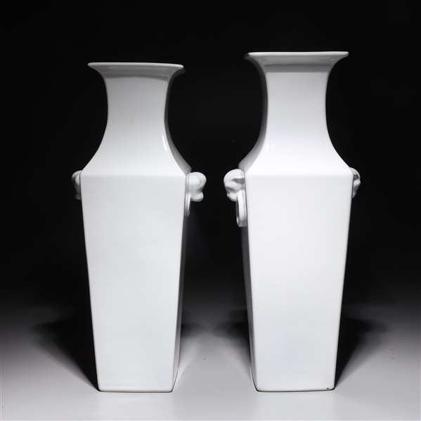 Appraisal: Two Chinese white glazed square form porcelain vases with mask