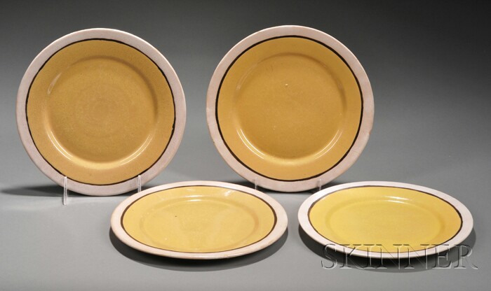 Appraisal: Four Saturday Evening Girls Yellow-glazed Plates Glazed pottery Boston and