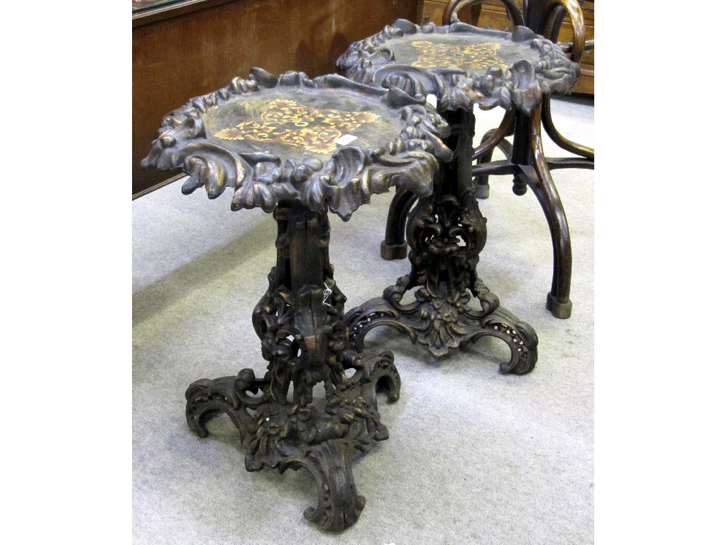 Appraisal: Pair of ornately cast metal pedestal occasional tables with painted