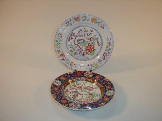 Appraisal: A thC ironstone china pudding dish polychrome decorated with Chinese