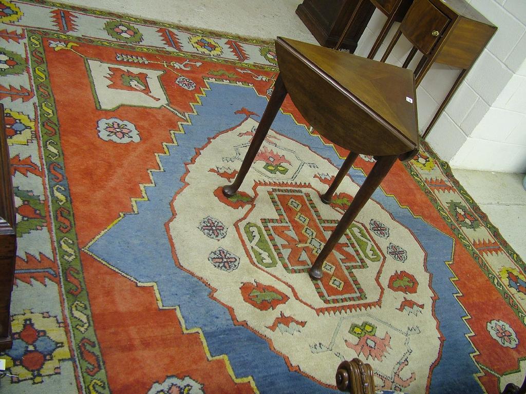 Appraisal: Turkish Kazak style wool carpet with geometric borders and central