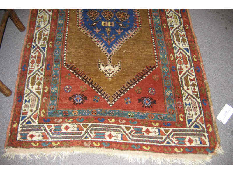 Appraisal: PERSIAN DESIGN LONG RUG Three diamond form medallions with floral