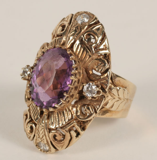 Appraisal: Gold K Egyptian style cocktail ring with central amethyst and