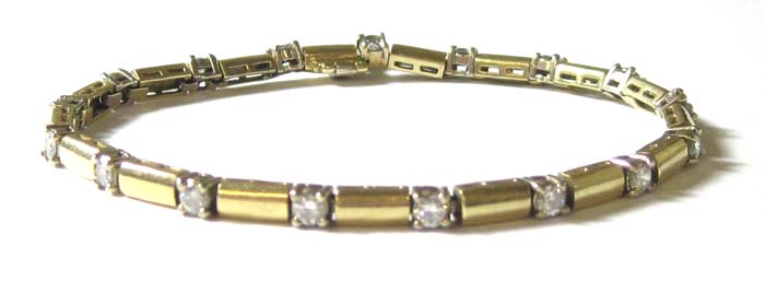 Appraisal: DIAMOND AND FOURTEEN KARAT GOLD BRACELET inches in length with