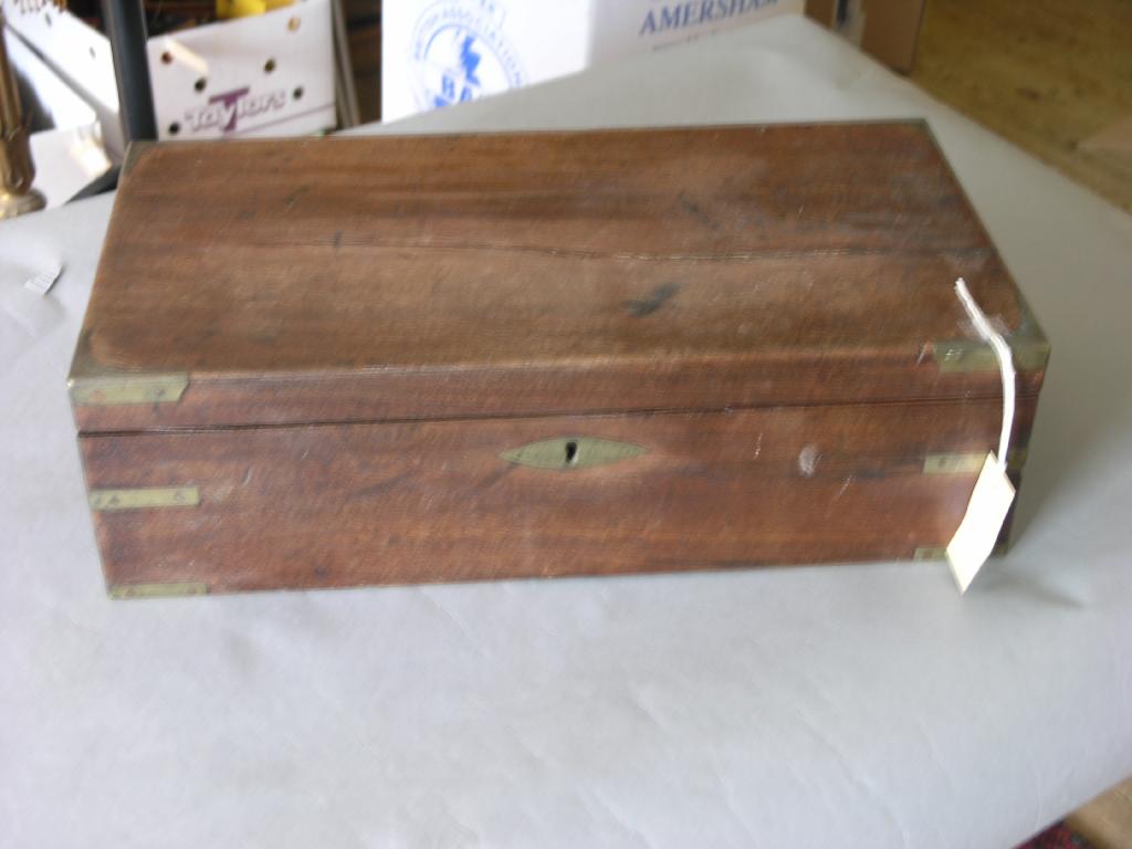 Appraisal: A Victorian mahogany and brass-mounted writing box with inset gilt-tooled