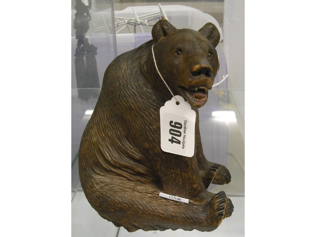 Appraisal: Black Forest wood carving of a seated bear high