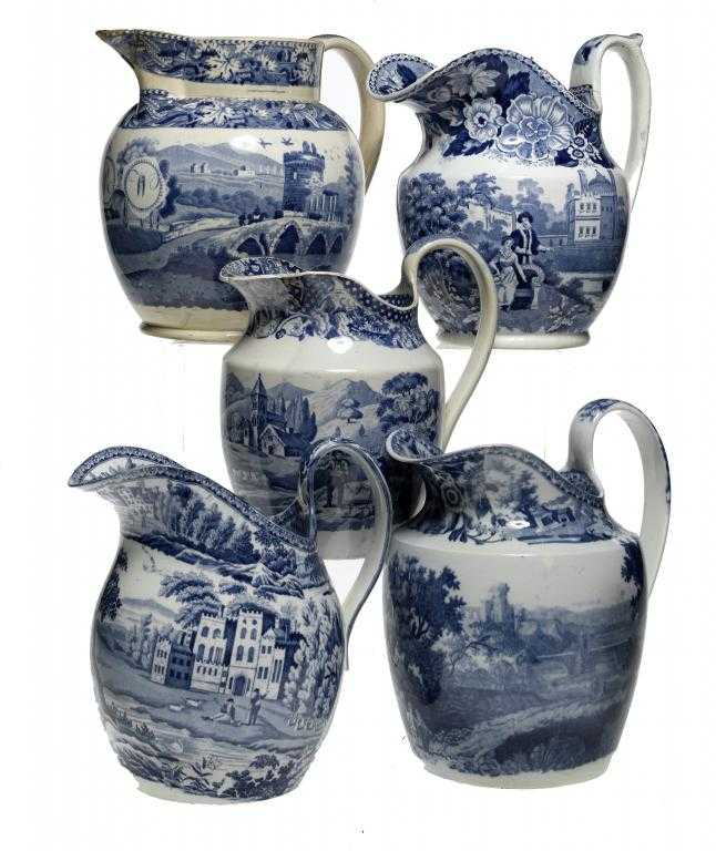 Appraisal: FIVE BLUE PRINTED EARTHENWARE JUGS various prints including the Bridge