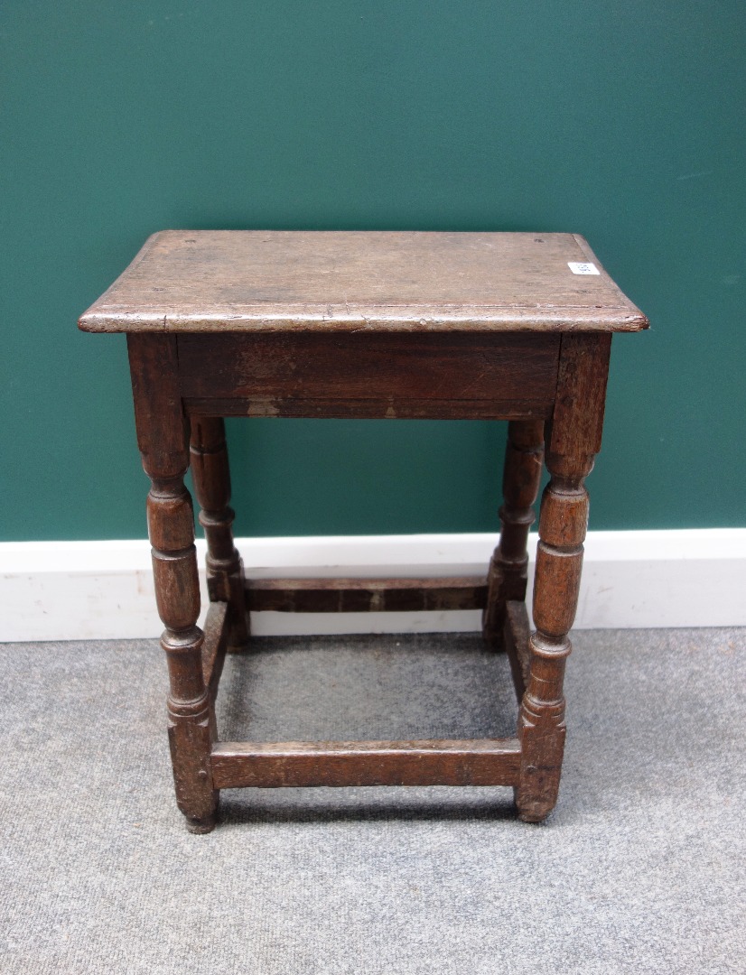 Appraisal: A Charles II oak joint stool on turned supports united