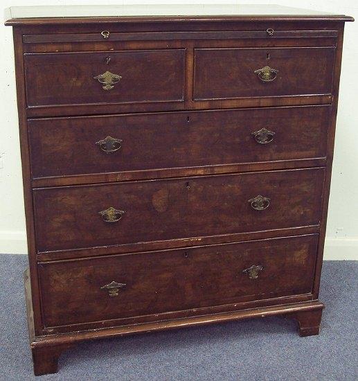 Appraisal: A walnut chest of th Century design the crossbanded top