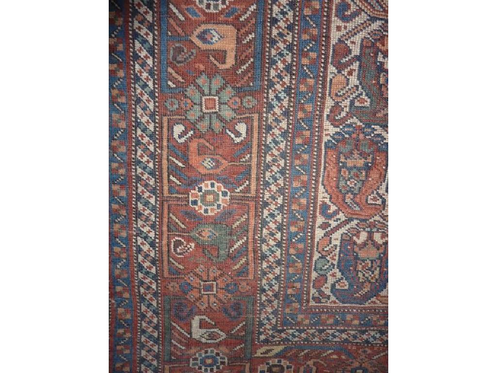 Appraisal: A Persian rug with geometric detail upon a white field