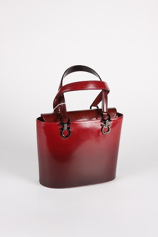 Appraisal: Salvatore Ferragamo red leather handbag with fold in top rounded