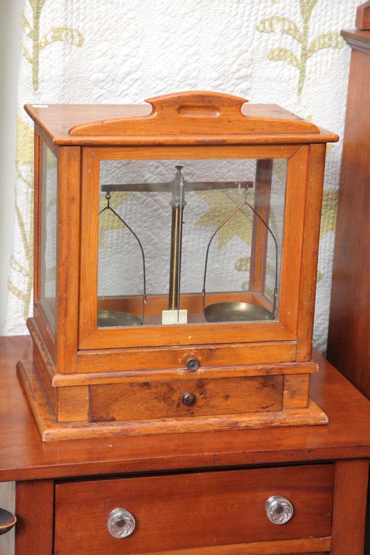 Appraisal: DRUGGIST SCALES IN WOODEN CASE Pine case with double balance