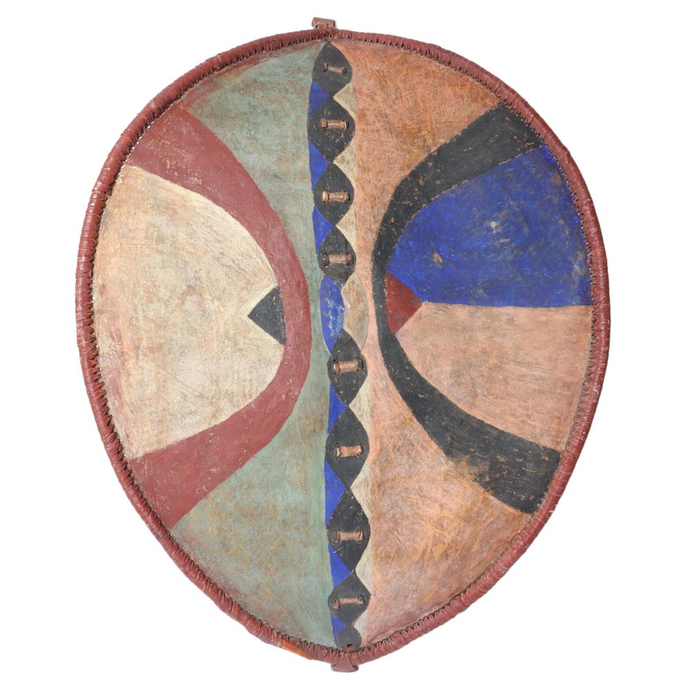 Appraisal: KENYAN MASSAI AFRICAN TRIBAL HIDE SHIELD WITH POLYCHROME DECORATION H