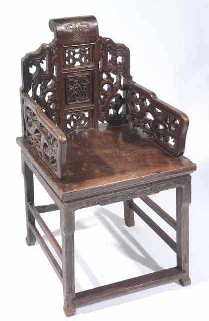 Appraisal: A CHINESE PROVINCIAL CARVED ARMCHAIR with open work back and