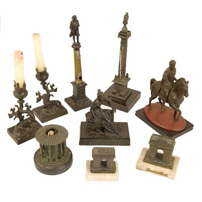 Appraisal: A pair of late th century bronze candlesticks with a