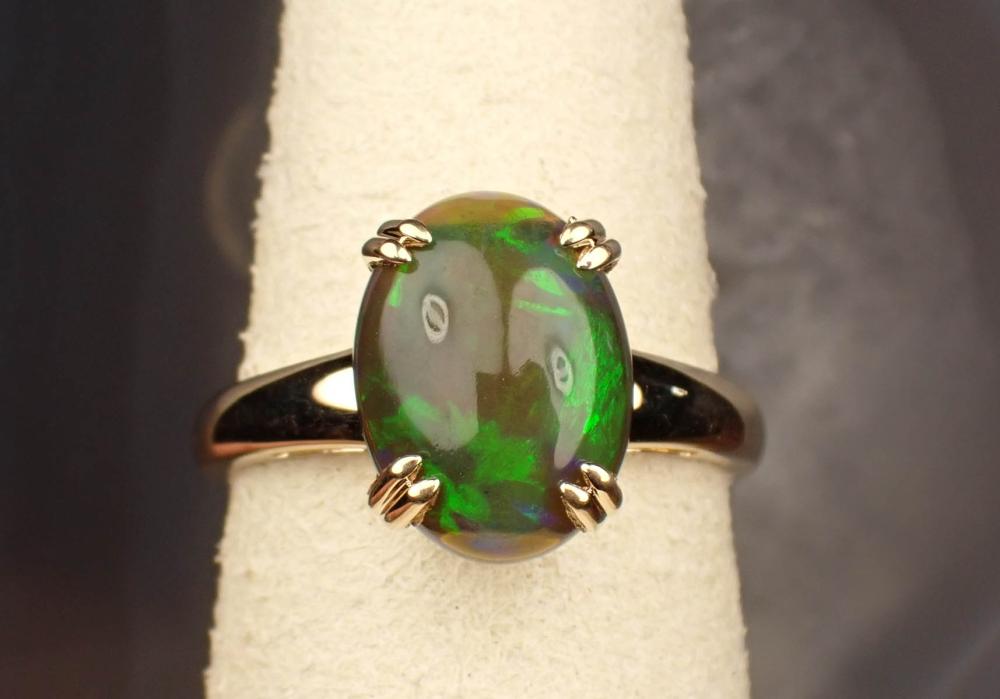 Appraisal: ETHIOPIAN BLACK OPAL AND FOURTEEN KARAT GOLD RING The yellow