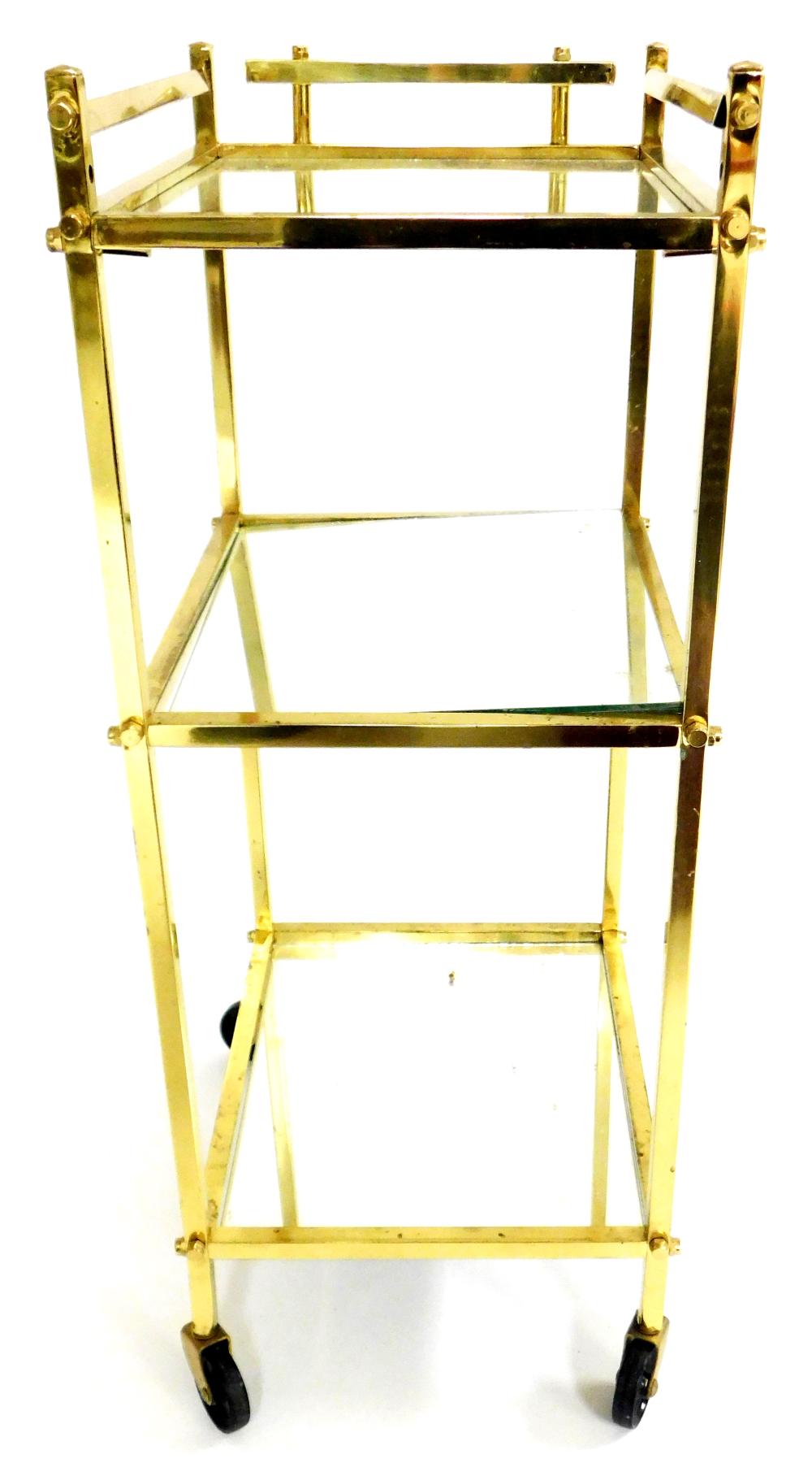 Appraisal: Pair of brass-toned metal three-tier stands with mirrored shelves late