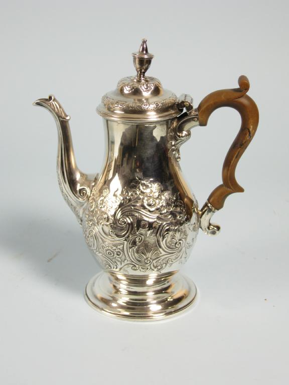 Appraisal: A George III Coffee Pot of baluster form finely chased