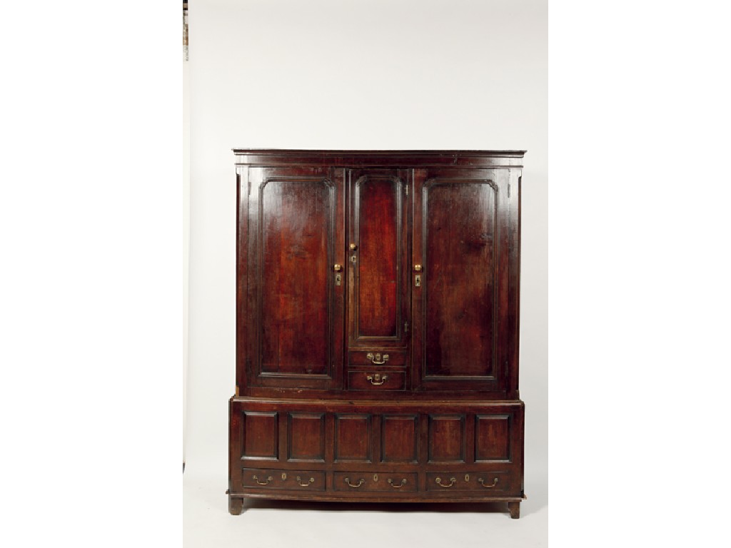 Appraisal: A GEORGE III OAK LIVERY CUPBOARD the top with a