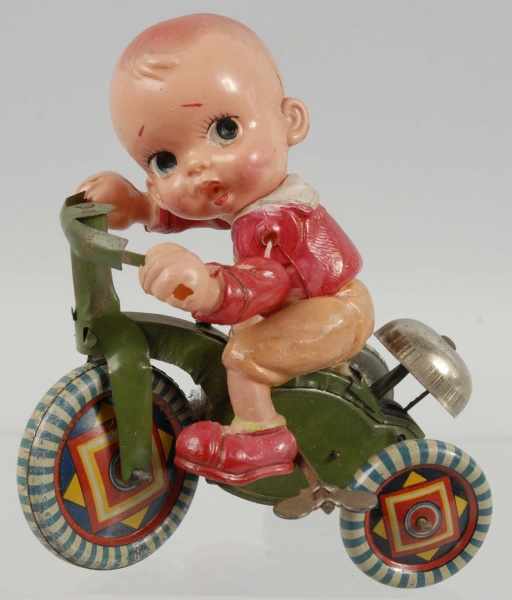 Appraisal: Celluloid Tin Bicycle Wind-Up Toy Description Japanese Pre-war Figure is