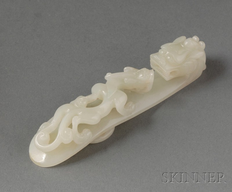 Appraisal: Jade Garment Hook th century gray-green stone dragon-head finial body