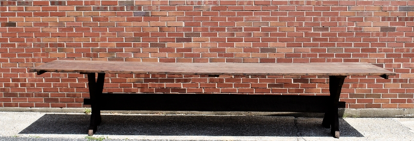 Appraisal: - Large sawbuck table with a two-board top h x