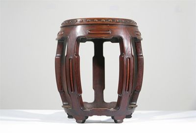 Appraisal: A Chinese hardwood barrel-shaped stool with five legs joined by