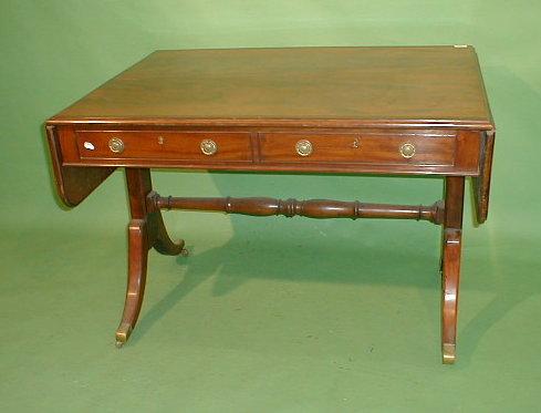 Appraisal: A Regency style sofa table with a flamed half veneered