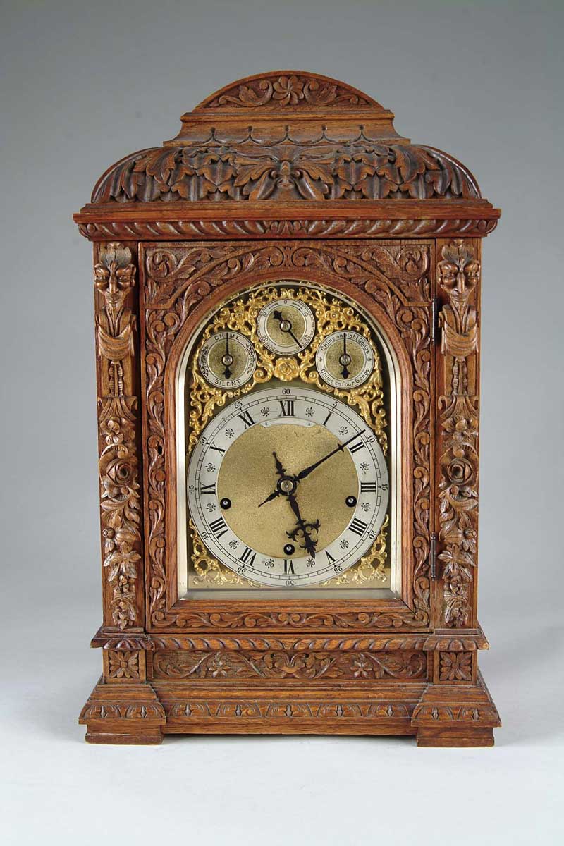 Appraisal: CARVED OAK MANTLE CLOCK Exceptional mantle clock has ornately carved