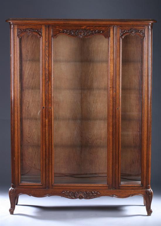 Appraisal: FRENCH LOUIS XV STYLE PROVINCIAL OAK VITRINE th century Molded-edge