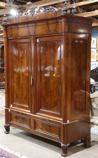 Appraisal: Austrian flame mahogany schrank circa having a shell and scroll