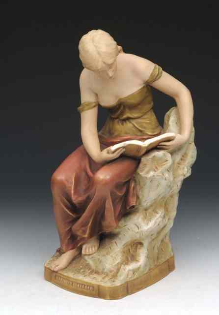 Appraisal: A ROYAL DUX FIGURINE of a lady reading in height